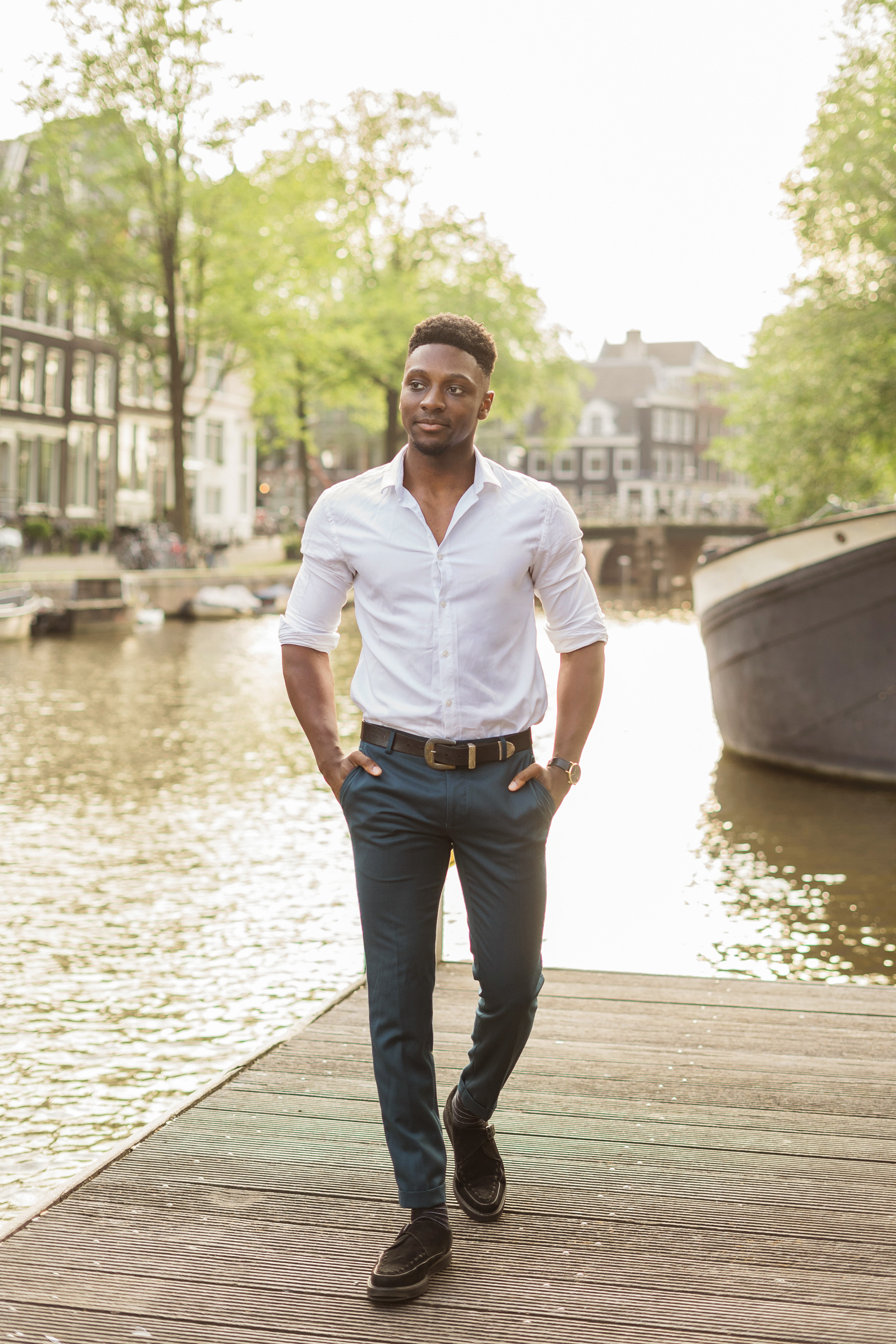 A man walking on Amsterdam's dock during his solo traveler photo session.