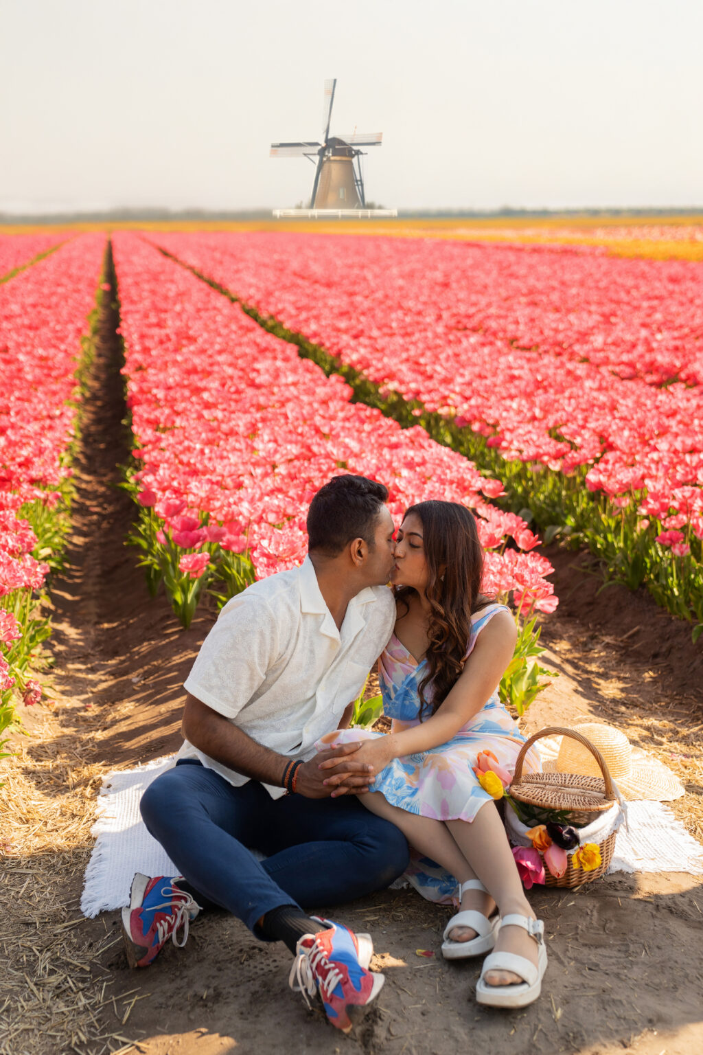 Couple tulip photoshoot day by a windmill in the Netherlands